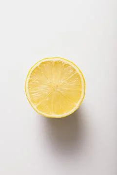 Half a lemon, top view on white Stock Photos