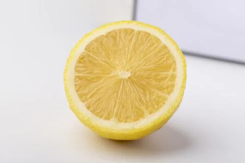 A half lemon on white background Stock Photos