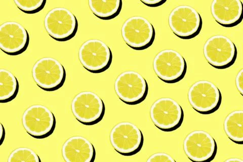 Half of lemon on yellow as a background. Stock Photos