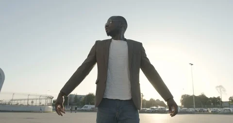 Half-length portrait of the calm attractive afro-american man in sunglasses Stock Footage 89601287