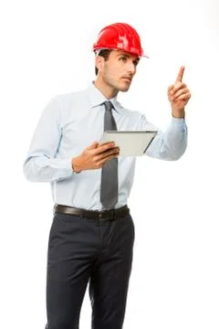 Half length portrait of a construction supervisor with digital tablet showing Stock Photos