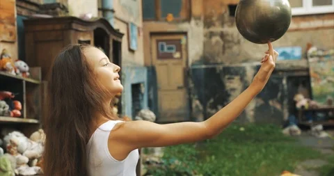 Half-length portrait of the little flexible girl performing dance with silver Stock Footage 93461383