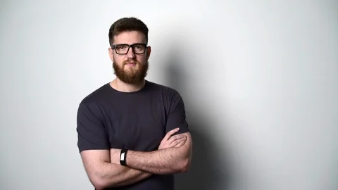 Half length portrait of young bearded hipster man smiling at camera Stock Footage 104425711