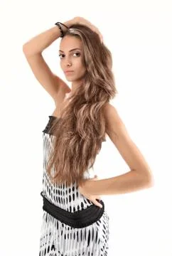 Half-length studio portrait of young pretty lady with long hairs on white Foto stock