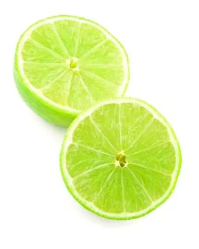 Half of lime citrus fruit isolated on white background with clipping path Stock Photos