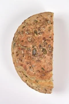 Half a Loaf of Seeded Bread on White Background Stock Photos
