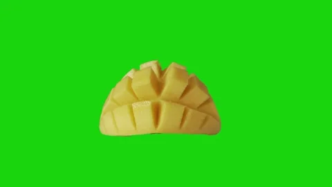 Half mango sliced cubed isolated on chromakey green screen background. Video stock 273483593
