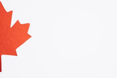 Half of maple leaf on white Canada Day background place for text Stock Photos