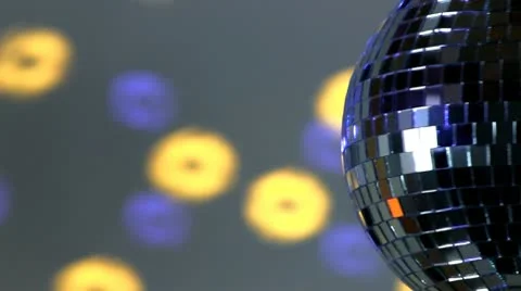 Half mirror ball; blue and yellow light Stock Footage 10758447