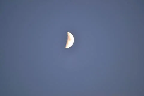 Half Moon Against Deep Blue Sky with Detailed Texture Stock Photos