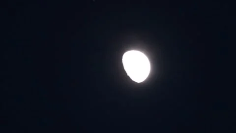 Half moon and thin clouds Stock Footage 242576385