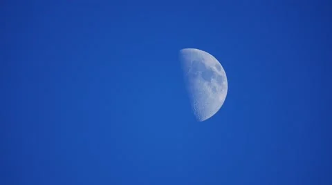 Half Moon in a Blue Sky Stock Footage 62605756