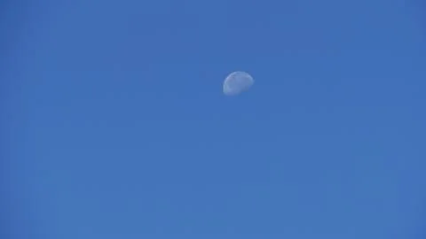 Half moon in blue sky Stock-Fotos