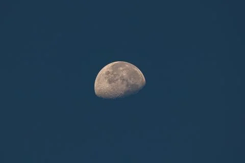 Half moon on blue sky Stock Photos
