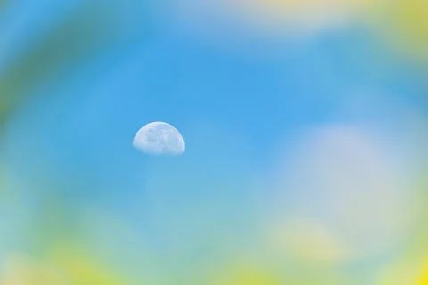 Half moon in blue sky soft blur frame Stock-Fotos