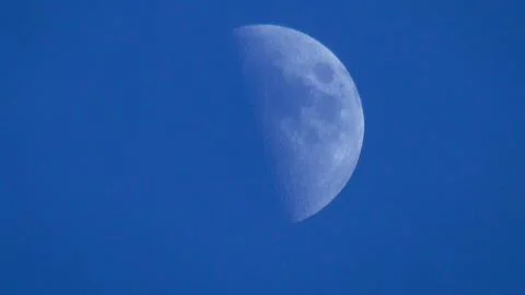 The Half Moon on a Cloudless Blue Sky 스톡 사진