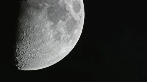 Half moon crossing showing off craters 4K Stock Footage