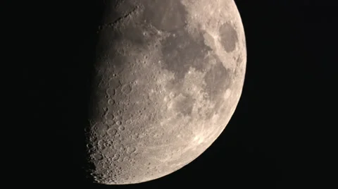 Half moon crossing showing off lower craters HD Video stock 36787720
