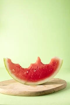 Half-moon cut watermelon with bite Stock Photos