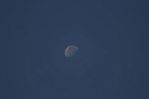 A half moon on a dark background Stock Photos