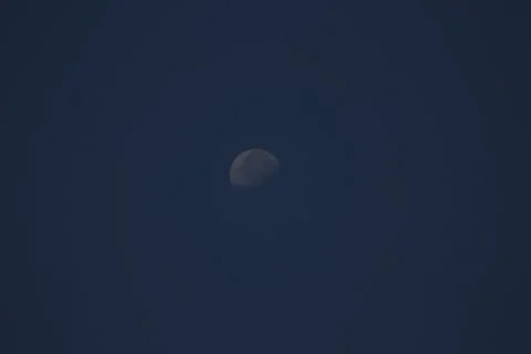 A half moon on a dark background Stock Photos