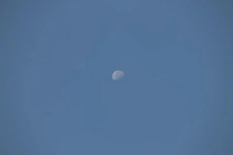 A half moon on a dark background Stock Photos