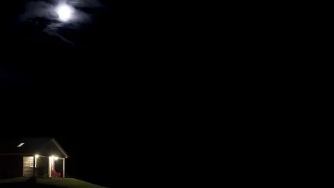 Half moon with earthshine sets over lonely cabin - timelapse Stock Footage 109524441