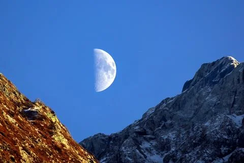 Half moon late evening in the mountains. astronomy and stargazing Stock Photos