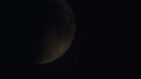Half moon moving on the night sky dome with some clouds going across silhouette. Stock Footage 158596947