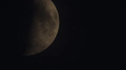 Half moon moving on the night sky dome with some clouds going across silhouette. Stock Footage 158600704
