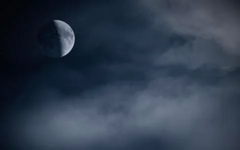 Half moon on night sky with clouds Super moon Stock Photos