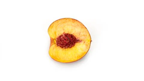 Half nectarine with stone on a white background from different sides. Macro Stock Photos