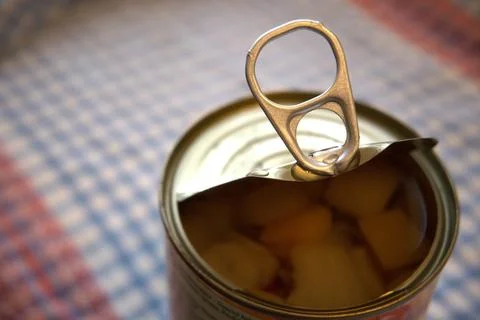 Half-open fruit salad can with copy space Photos