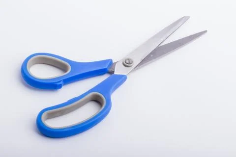 A half open pair of scissors with a blue grip Stock Photos