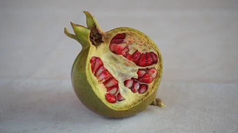 Half opened pomegranate in close-up view Stock Footage 119386439