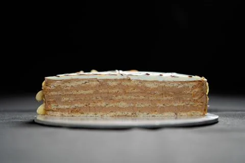 Half or slice of chocolate mousse cake isolated on black background. Stock Photos