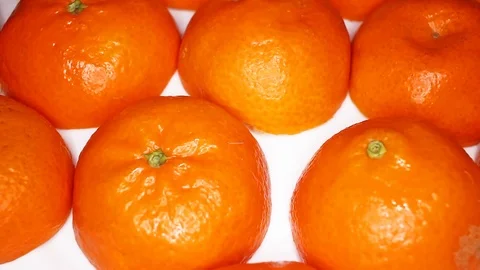 Half orange fruit fruits on rotating plate Stock Footage 110618145