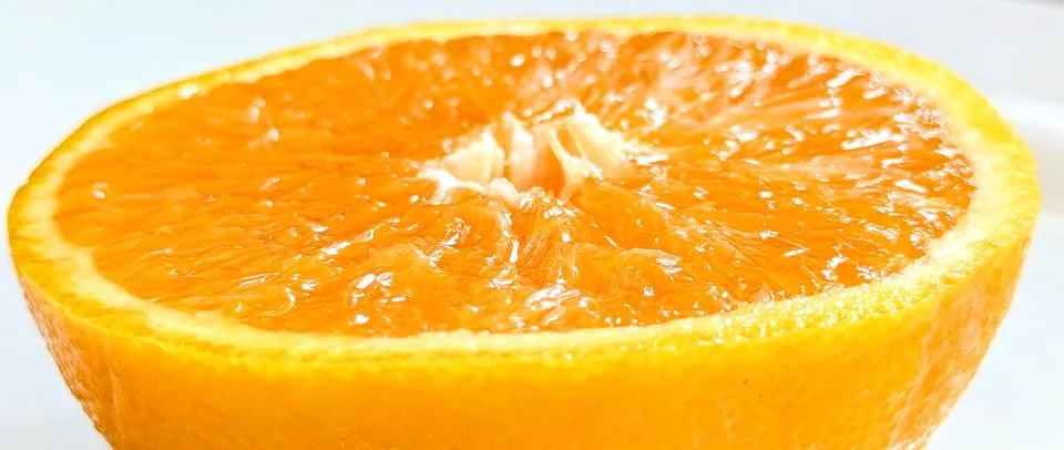 Half of orange isolated on white background. clipping path Stock Photos