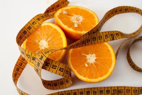 Half oranges wrapped with measure Stock Photos