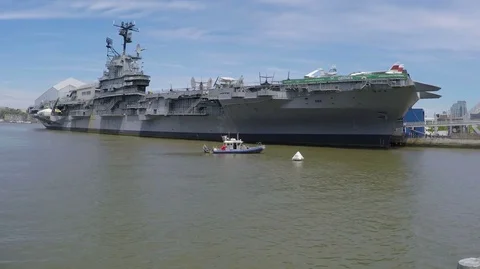 Half Pan of USS Intrepid and New York City Police (NYPD) Boat   Stock Footage 75427166