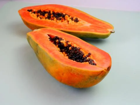 Half a papaya fruit. Close-up. 库存照片