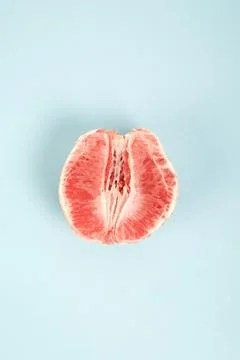 Half peeled grapefruit Stock Photos
