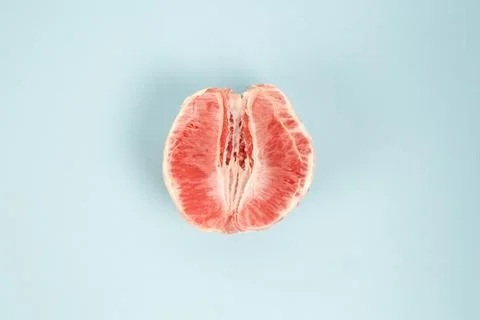 Half peeled grapefruit Stock Photos