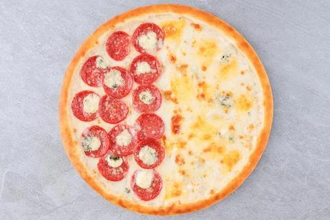 Half Pepperoni and Half Four Cheese Pizza with Mozzarella, Blue Cheese and Stock Photos