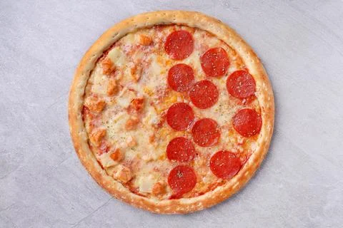 Half Pepperoni and Half Pineapple Chicken Gourmet Pizza Feast Stock Photos