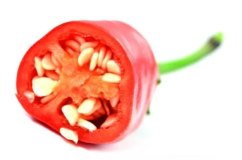 Half pieced chilli pepper with seeds isolated on white background. Stock Photos