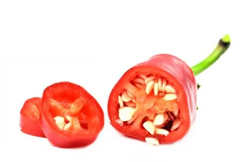 Half pieced chilli pepper with seeds and slices isolated on white background. Foto stock