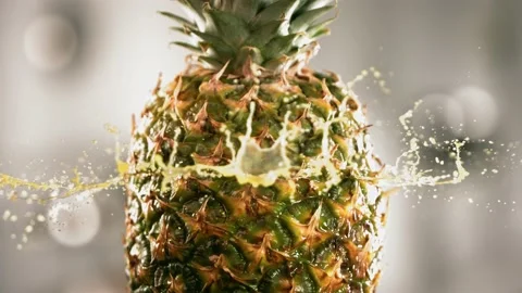 Half Pineapple falling and splashing on white background. Food levitation Stock Footage 199016416
