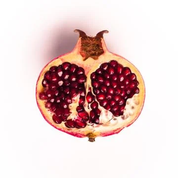 Half of pomegranate Stock Photos