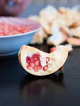 Half of pomegranate on table close up Stock Photos